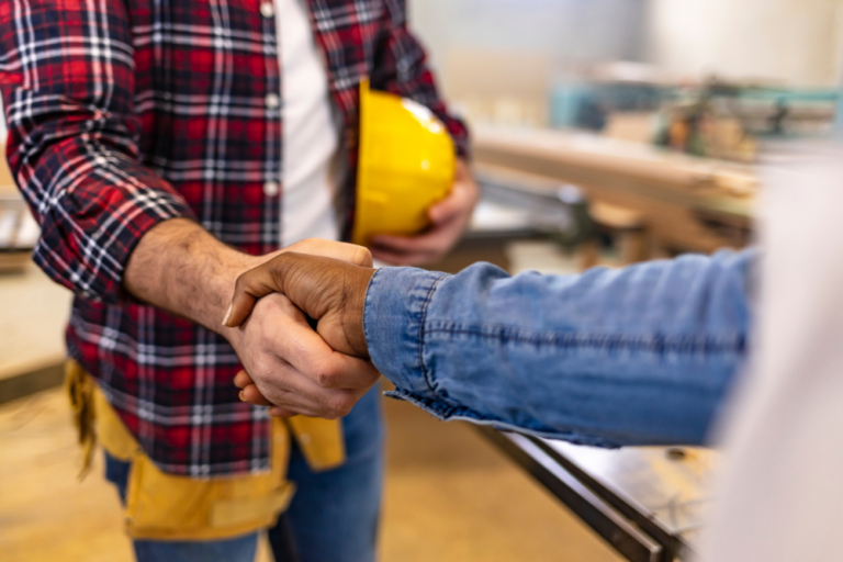Contractor and homeowner discussing the cost of radon mitigation in missouri